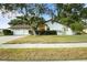 Charming single-story home featuring a well-manicured lawn and an attached two-car garage at 781 Bryson Loop, Lakeland, FL 33809