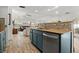 Kitchen features a breakfast bar looking into a sun-filled living room at 781 Bryson Loop, Lakeland, FL 33809