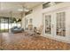 Relaxing patio with rocking chairs, porch swing, and tiled floor, perfect for outdoor enjoyment at 781 Bryson Loop, Lakeland, FL 33809