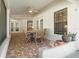 Inviting patio with tile floor, ceiling fan, and outdoor furniture perfect for dining or relaxing at 781 Bryson Loop, Lakeland, FL 33809
