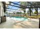 A sparkling in-ground pool with screened enclosure offers a relaxing outdoor space at 781 Bryson Loop, Lakeland, FL 33809