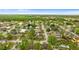 Overhead image featuring the location of this home in a neighborhood filled with mature trees and verdant lawns at 7952 Grand Pines Blvd, Lakeland, FL 33810