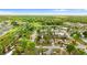 Aerial view with pin highlighting the location of this home within a lush and verdant community at 7952 Grand Pines Blvd, Lakeland, FL 33810