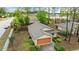 Aerial view of a home with a two-car garage, driveway, and landscaped front yard at 7952 Grand Pines Blvd, Lakeland, FL 33810