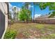 Spacious, fenced backyard with ample green space and mature trees at 7952 Grand Pines Blvd, Lakeland, FL 33810