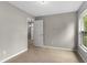 Neutral bedroom with tiled floors and a window bringing in natural light at 7952 Grand Pines Blvd, Lakeland, FL 33810