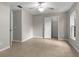 Bedroom boasts tile floors, a ceiling fan, and spacious walk-in closet at 7952 Grand Pines Blvd, Lakeland, FL 33810