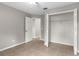 Bedroom with tile floors boasts a ceiling fan and a spacious, open closet at 7952 Grand Pines Blvd, Lakeland, FL 33810