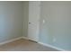 Cozy bedroom with neutral walls, a standard closet door, and tile floors for a clean, modern feel at 7952 Grand Pines Blvd, Lakeland, FL 33810