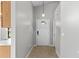 Bright foyer with tile floors, pendant light, and access to other rooms at 7952 Grand Pines Blvd, Lakeland, FL 33810