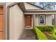 Close up exterior of front door with manicured shrubs at 7952 Grand Pines Blvd, Lakeland, FL 33810