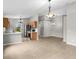 Bright kitchen features modern appliances and a breakfast bar, seamlessly connecting to the dining area at 7952 Grand Pines Blvd, Lakeland, FL 33810