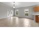 Open concept living area features ceramic tile and natural light at 7952 Grand Pines Blvd, Lakeland, FL 33810