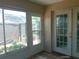 Sunroom with tile flooring and sliding glass doors at 7952 Grand Pines Blvd, Lakeland, FL 33810