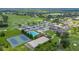 Community view with pool, tennis courts, clubhouse and surrounding golf courses at 800 Osprey Landing Dr, Lakeland, FL 33813