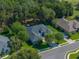 Beautiful aerial view of the property showcasing lush landscaping and a well-maintained yard at 800 Osprey Landing Dr, Lakeland, FL 33813