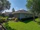 Beautifully landscaped backyard with a patio area, perfect for outdoor gatherings and enjoying the scenery at 800 Osprey Landing Dr, Lakeland, FL 33813