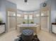 Bright bathroom features a soaking tub, dual walk-in showers, and neutral tile at 800 Osprey Landing Dr, Lakeland, FL 33813