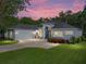 Charming single-story home boasts a well-manicured lawn and beautiful landscaping at 800 Osprey Landing Dr, Lakeland, FL 33813