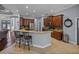 Well-equipped kitchen featuring granite countertops, stainless steel appliances, and a breakfast bar with seating at 800 Osprey Landing Dr, Lakeland, FL 33813