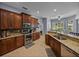 Well-lit kitchen featuring granite countertops, stainless steel appliances, and custom cabinets at 800 Osprey Landing Dr, Lakeland, FL 33813
