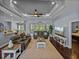 Spacious living room with dark hardwood floors, ceiling fan, with sliding glass doors to the pool at 800 Osprey Landing Dr, Lakeland, FL 33813