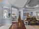 Open floor plan with hardwood floors leads to dining and kitchen areas at 800 Osprey Landing Dr, Lakeland, FL 33813