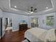 Cozy main bedroom featuring a trey ceiling, a ceiling fan, and sliding glass doors to a lanai at 800 Osprey Landing Dr, Lakeland, FL 33813