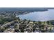 Beautiful aerial shot showcasing homes nestled amidst lush greenery along a picturesque lake at 818 Fairlane Dr, Lakeland, FL 33809
