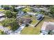 Aerial view of a home showcasing a large fenced yard with a trampoline and covered RV parking at 818 Fairlane Dr, Lakeland, FL 33809