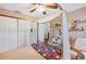 Charming bedroom featuring a four-poster bed, delightful decorations, and soft lighting at 818 Fairlane Dr, Lakeland, FL 33809