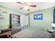 Comfortable bedroom with a gray bed, soft lighting, and stylish decor at 818 Fairlane Dr, Lakeland, FL 33809