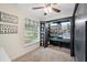 Versatile bedroom featuring a built-in craft area, a window with blinds, and a ceiling fan at 818 Fairlane Dr, Lakeland, FL 33809