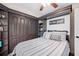 Charming bedroom with built-in storage, decorative wall art, and a ceiling fan at 818 Fairlane Dr, Lakeland, FL 33809