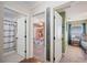 Hallway view of a bedroom and bathroom with a height marker on the wall at 818 Fairlane Dr, Lakeland, FL 33809