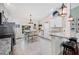 Modern kitchen with white cabinets, granite countertops, stainless steel appliances and a breakfast bar at 818 Fairlane Dr, Lakeland, FL 33809