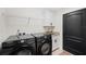 The laundry room features modern appliances, a sink, and storage at 818 Fairlane Dr, Lakeland, FL 33809
