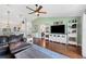 Comfortable living area with a ceiling fan and views into the kitchen and entryway at 818 Fairlane Dr, Lakeland, FL 33809