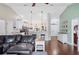 Inviting living room with hardwood floors, vaulted ceilings, and an open layout at 818 Fairlane Dr, Lakeland, FL 33809