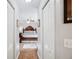 View of the main bedroom featuring a wooden bed frame, ceiling fan, and cozy carpet at 818 Fairlane Dr, Lakeland, FL 33809