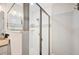 Shower featuring a glass door and shower head at 818 Fairlane Dr, Lakeland, FL 33809