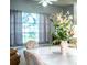 Dining room featuring a table with floral centerpiece, neutral walls, and bright natural light at 909 Lake Deeson Pt, Lakeland, FL 33805