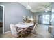Dining room with table and chairs open to the living room, perfect for entertaining guests at 909 Lake Deeson Pt, Lakeland, FL 33805