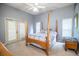 Main bedroom with light grey walls, ceiling fan and exterior door at 909 Lake Deeson Pt, Lakeland, FL 33805