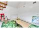 Large playroom featuring a learning center, toys, and a spiral staircase at 3822 Charter Rd, Lakeland, FL 33810