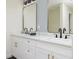 Bathroom with a double marble vanity and black faucets, with gold accents at 10470 Sw 139Th Ct, Dunnellon, FL 34432