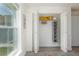 Walk-in closet with neat organization, including shelves, hanging space, and a bi-fold door at 10470 Sw 139Th Ct, Dunnellon, FL 34432