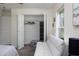 Bright bedroom featuring closet with ample storage, and white couch near the window at 10470 Sw 139Th Ct, Dunnellon, FL 34432