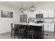 Kitchen featuring a large center island with marble countertops and barstool seating at 10470 Sw 139Th Ct, Dunnellon, FL 34432