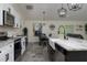 Open concept kitchen and dining space featuring modern lighting and stylish decor at 10470 Sw 139Th Ct, Dunnellon, FL 34432